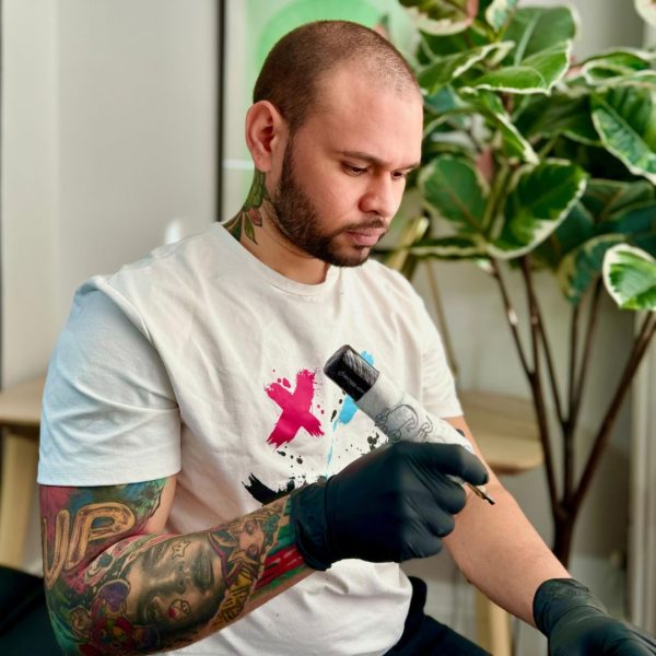 Resident artist Carlos Caledera tattooing at our Cardiff tattoo studio.