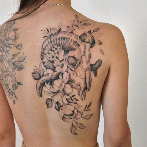 A fine line floral back piece.
