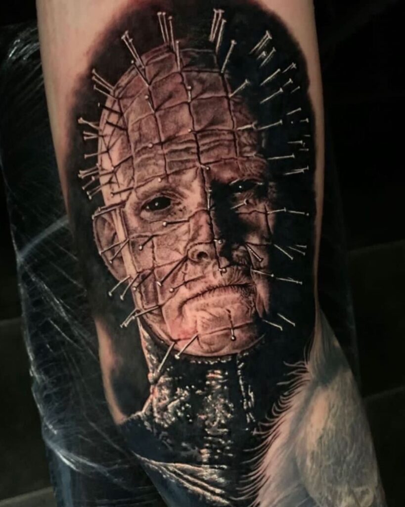 Black and grey tattoo of Pinhead from Hellraiser